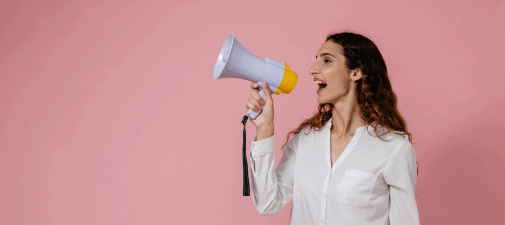 Image of a woman yelling into a megaphone for a Pacific Coast Advertising blog post about Affordable Marketing Ideas for Small Businesses That Actually Work